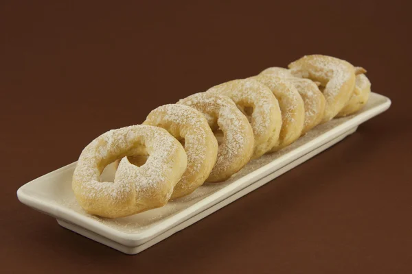 Sweet custard rings with sugar powder — Stock Photo, Image