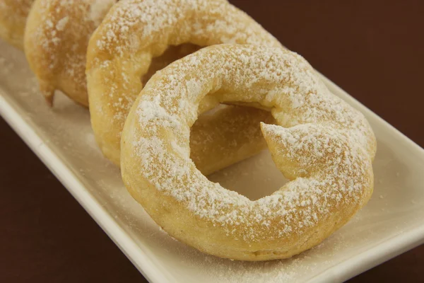 Sweet custard rings with sugar powder — Stock Photo, Image