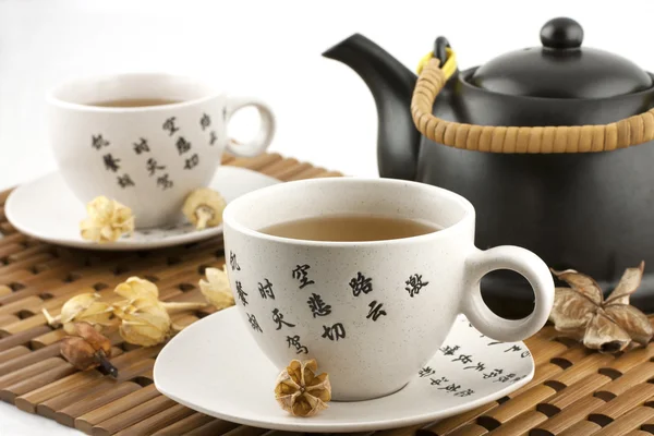 Still life with tea mugs and teapot — Stock Photo, Image