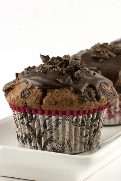 Chocolate muffins with cream — Stock Photo, Image