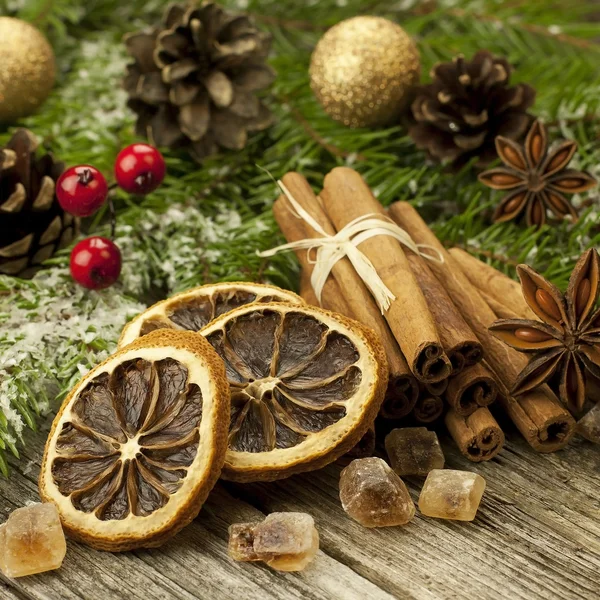 Christmas spices on wooden surface — Stock Photo, Image