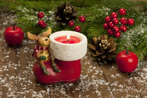 Christmas composition with candle and decoration — Stock Photo, Image