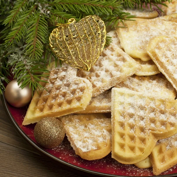 Christmas composition with baked heart waffles and color balls — Stock Photo, Image