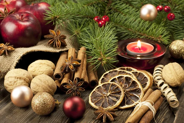 Christmas still life with spices and candle — Stock Photo, Image