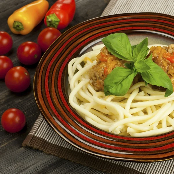 Bowl with meatballs and pasta with tomato sauce — Stock Photo, Image