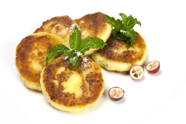 Cottage cheese pancakes on a white plate — Stock Photo, Image