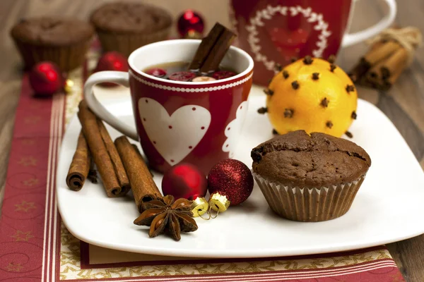 Christmas still life with tea cup and muffins — Stock Photo, Image