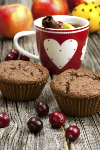 Christmas mug with chocolate muffins — Stock Photo, Image