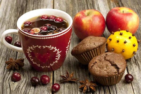 Christmas mug with chocolate muffins — Stock Photo, Image