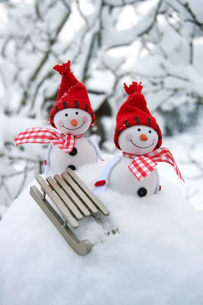 Happy snowman friends in drifts — Stock Photo, Image
