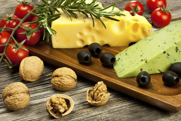 Cheese various assortment on wooden board — Stock Photo, Image