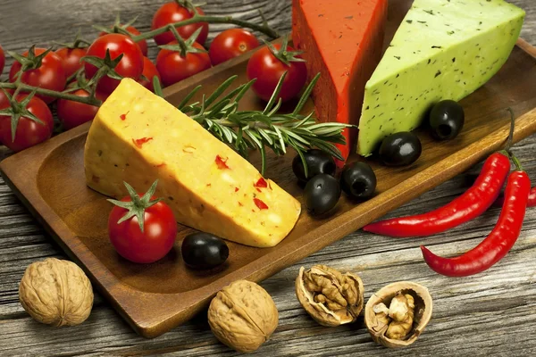 Cheese various assortment on wooden board — Stock Photo, Image