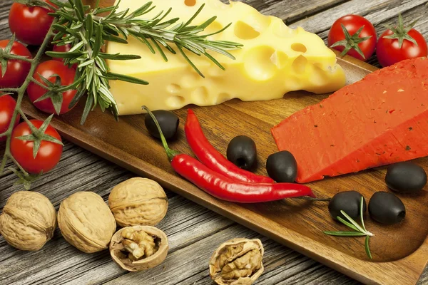 Cheese various assortment on wooden board — Stock Photo, Image