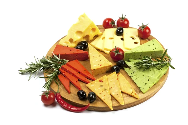 Various types of cheese on a wooden board — Stock Photo, Image