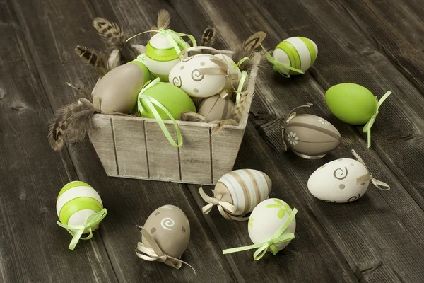 Easter eggs in the vintage box  on rustic wooden surface — Stock Photo, Image