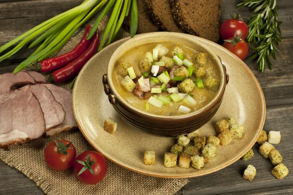 Pea soup with carrot and bacon in pot — Stock Image Pea soup with carrot and bacon in pot Royalty Free Stock Photos