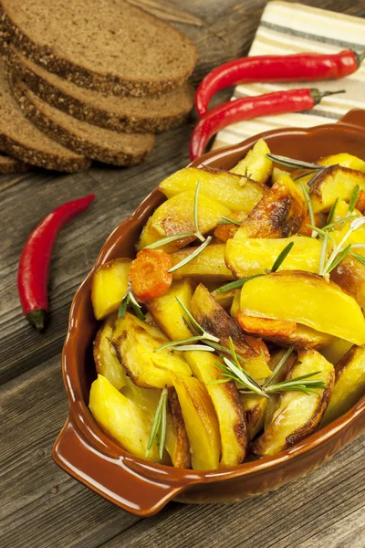 Potatoes baked in  oven with spices and rosemary — Stock Photo, Image
