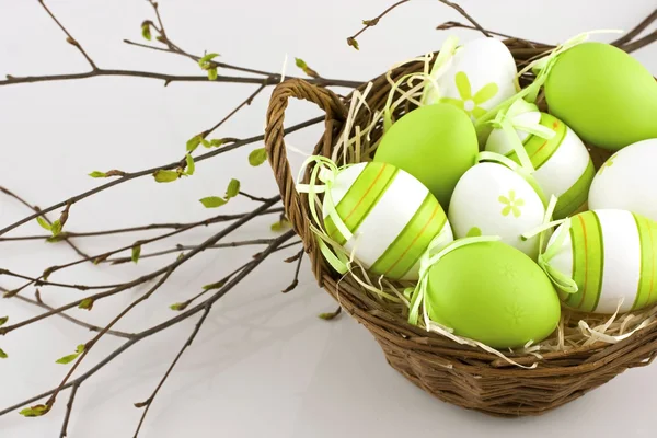 Easter still life with colorfull eggs  in  wicker  basket — Stock Photo, Image
