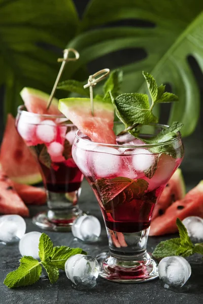 Watermelon alcoholic or non-alcoholic drink, mojito cocktail with mint and ice