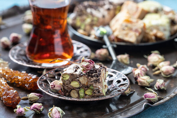 Turkish  tea with eastern sweets on traditional copper serving set