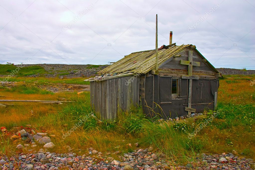 Old abandoned fishermans cabin at White Sea coast, northern Russ