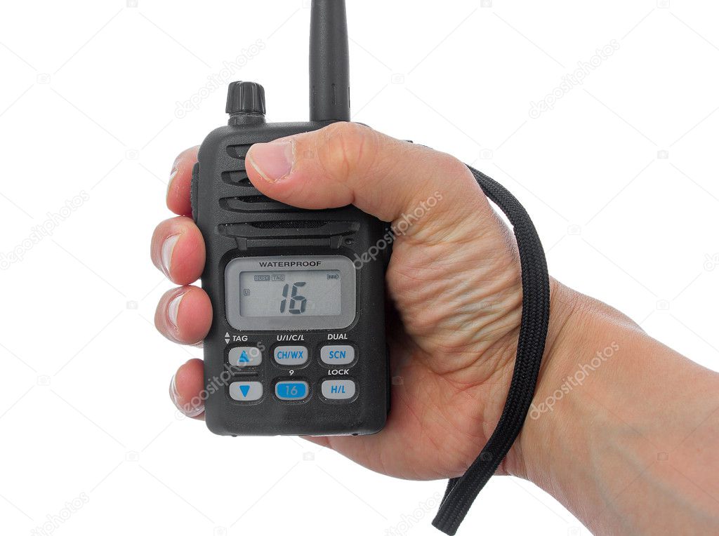 Man hand grasping marine radio.