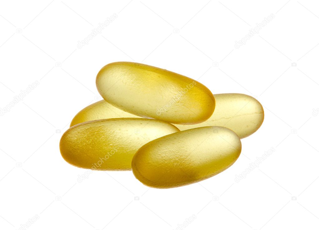 Yellow semi-transparent pills isolated on white background