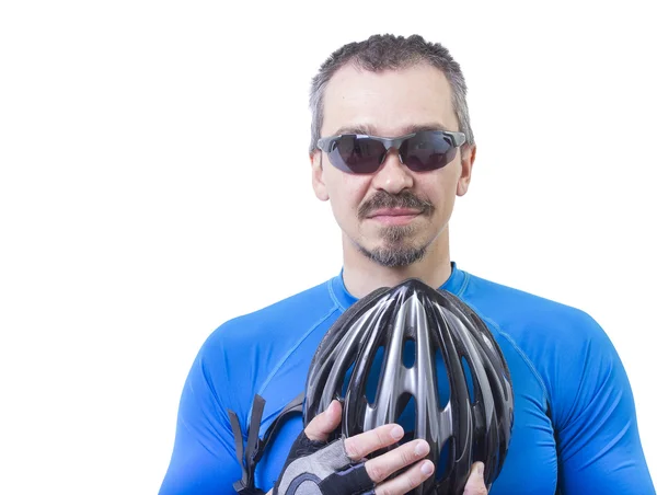 Adult bicyclist standing with helmet in his hands — Stock Photo, Image