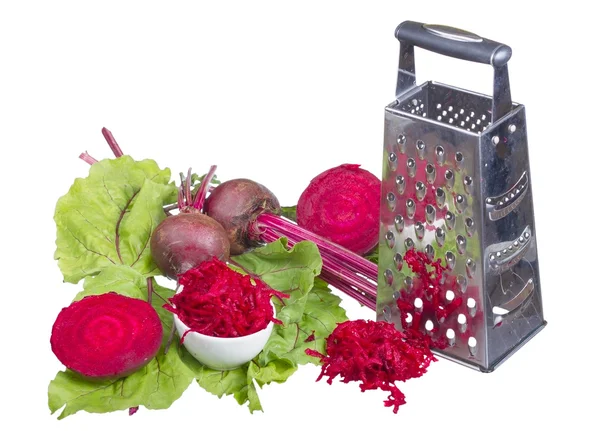 Stainless steel grater and grated beet. — Stock Photo, Image