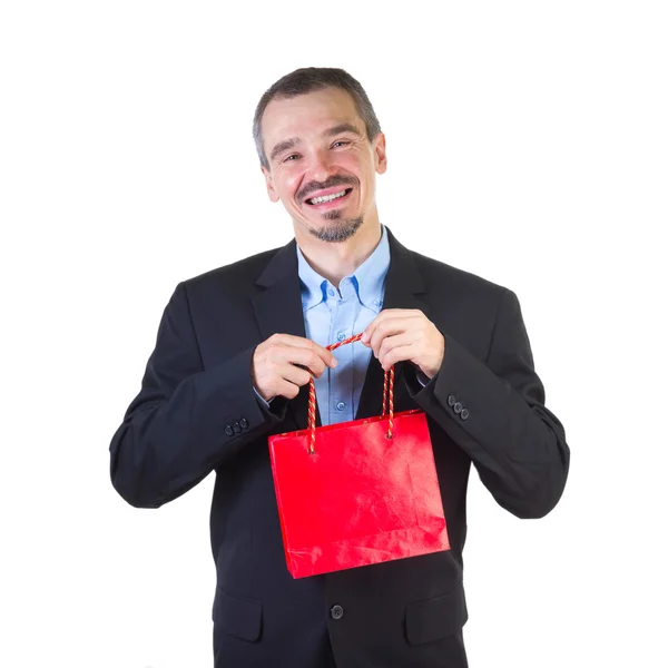 Homem feliz com saco vermelho de compras . — Fotografia de Stock