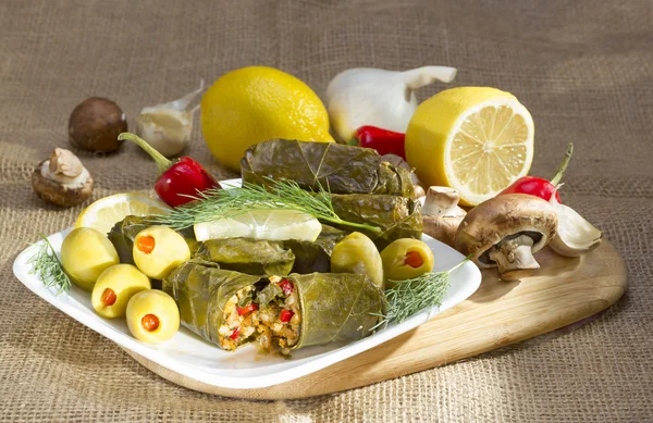 Grape leaves stuffed with rice. — Stock Photo, Image