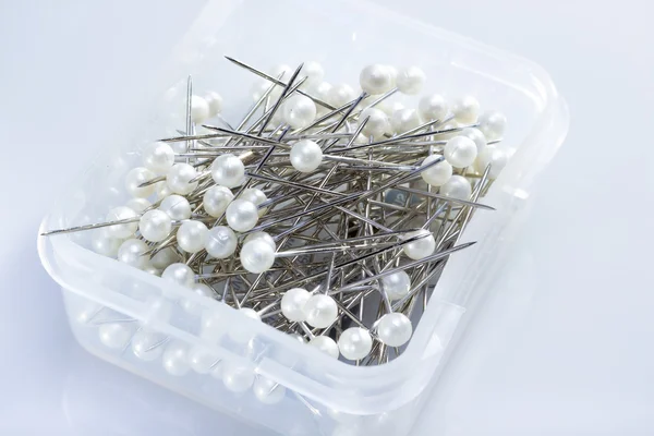 Pins in white box. — Stock Photo, Image