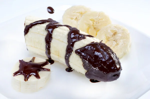 Banana com molho de chocolate . — Fotografia de Stock