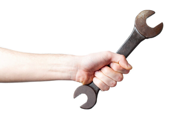 The hand holds a spanner