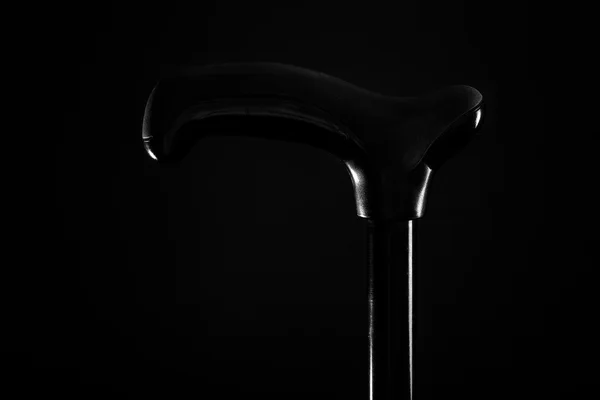 Walking stick isolated on black background — Stock Photo, Image