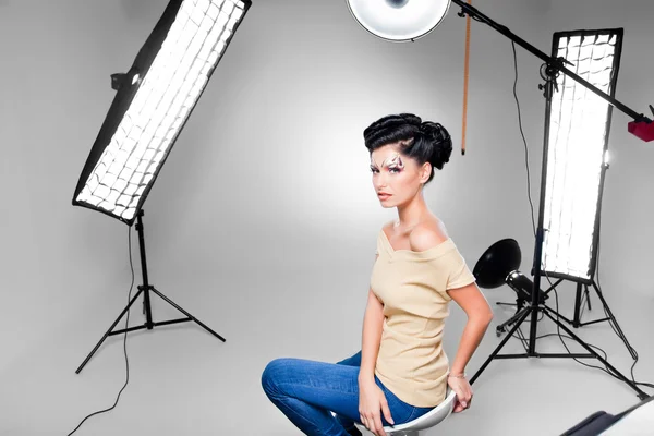 Young model posing in professionally equipped studio — Stock Photo, Image