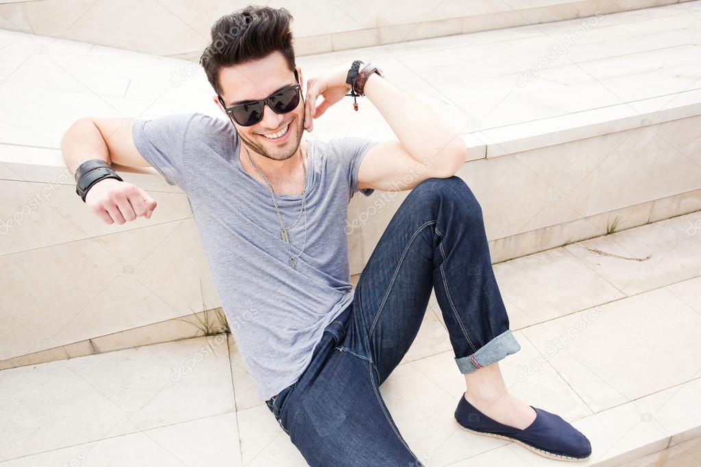 attractive man dressed casual posing outdoors