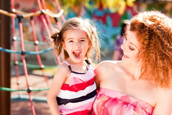 Mother and daughter on the playground — Stock Photo, Image