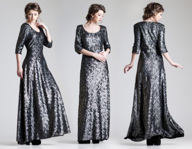 Stüdyoda zarif bir elbiseyle poz veren güzel bir kadın.