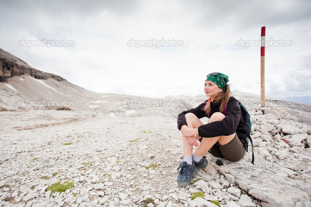 cute girl hiking in the alps