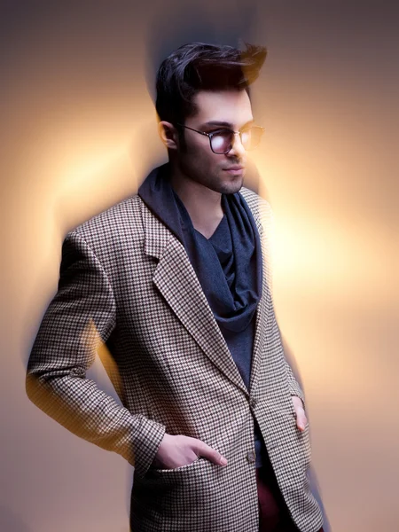 Fashion man model dressed casual posing dramatic - intentional motion blur — Stock Photo, Image