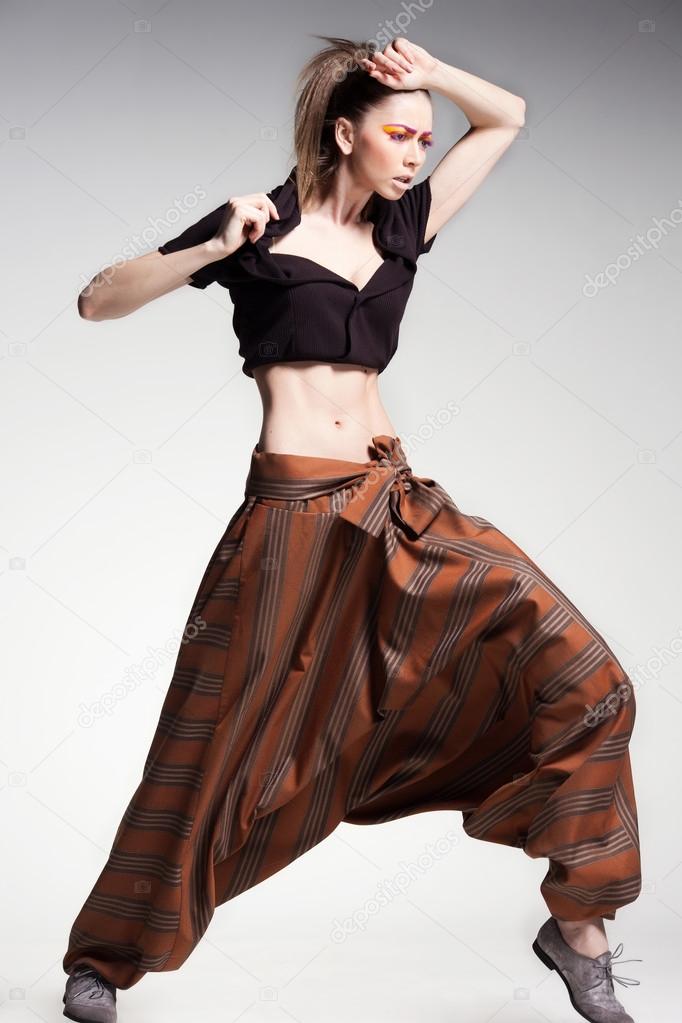 sexy woman model posing in large (salwar) pants - studio fashion shot
