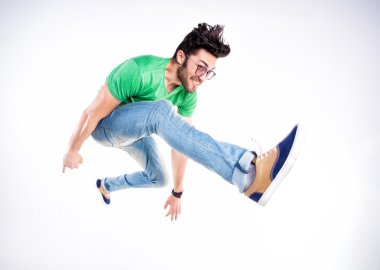 handsome man dressed casual jumping and smiling - dynamic wide clipart