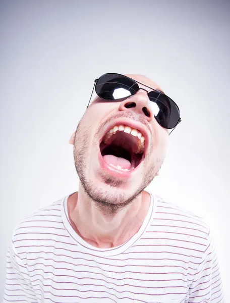 Funny guy wearing sunglasses screaming - fish eye shot — Stock Photo, Image