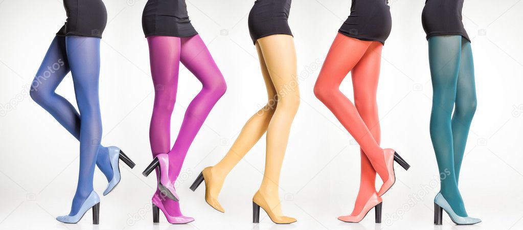 collection of colorful stockings on sexy woman legs isolated on grey