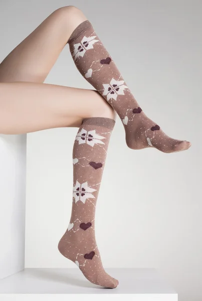 Woman legs in winter socks — Stock Photo, Image