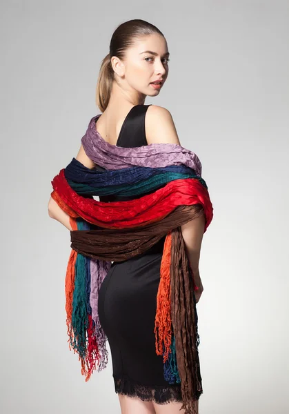 Woman wearing a collection of scarves — Stock Photo, Image