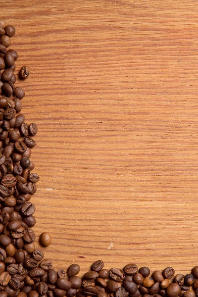 Coffee bean on wooden background — Stock Photo, Image