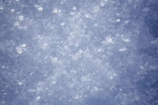 Flocos de neve branco fundo, padrão áspero de textura de neve — Fotografia de Stock