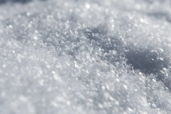 Flocos de neve branco fundo, padrão áspero de textura de neve — Fotografia de Stock